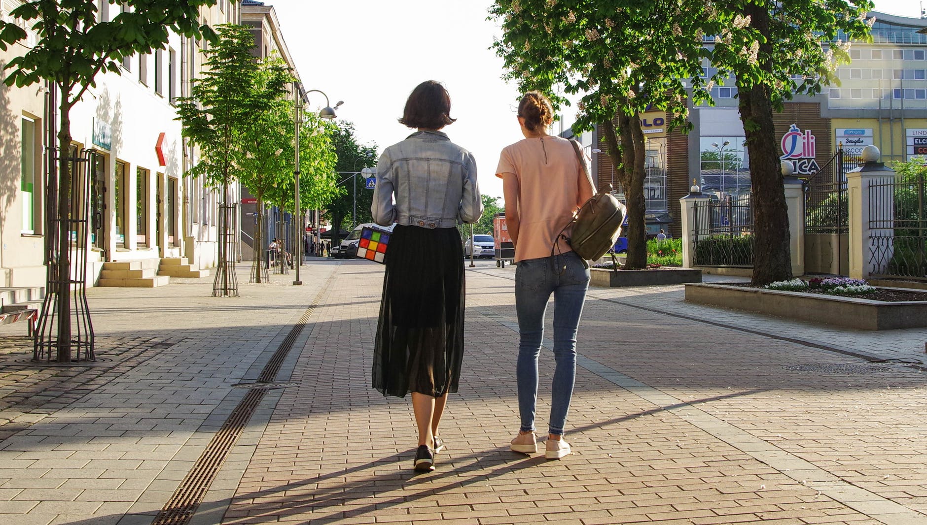 photo of women walking down the street